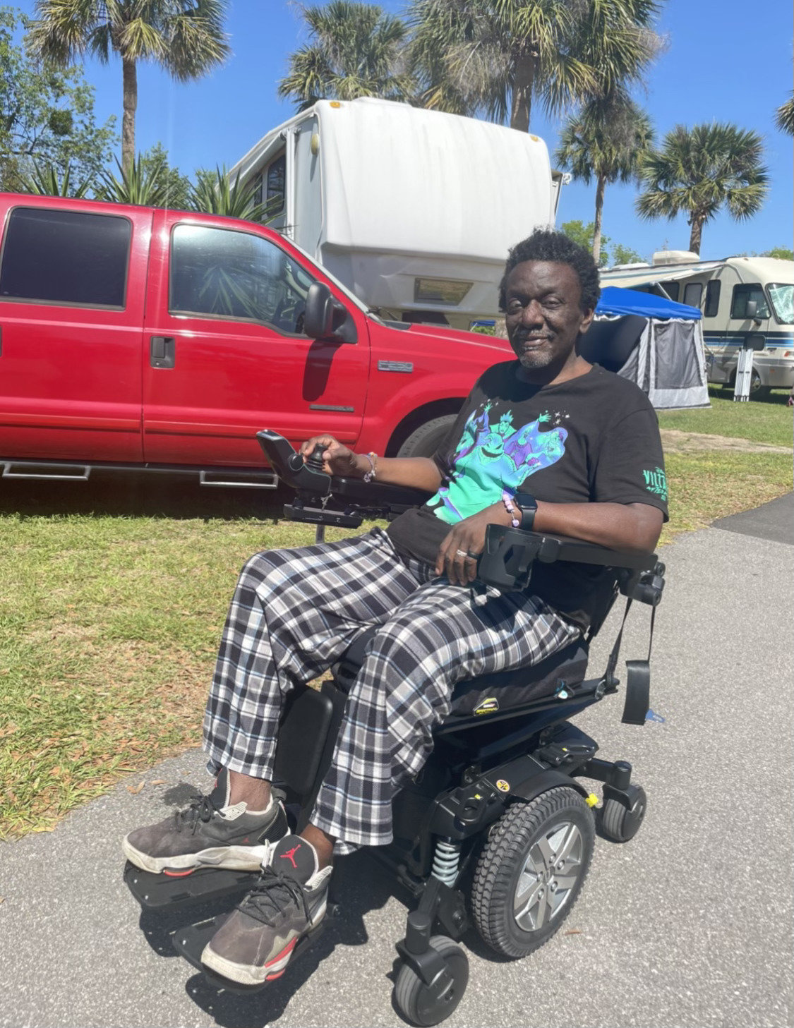 Kevin Bowie shows off his new wheelchair.
